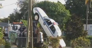 Police Car Up Telephone Pole