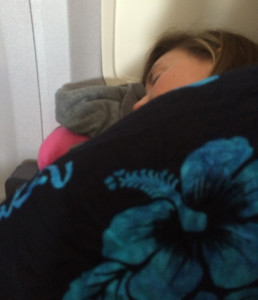 It may look like she has found a full-sized bed on our plane, but I can assure you that she has not